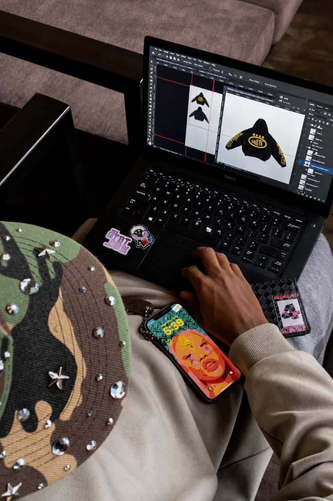 Designing a custom brand hoodie on laptop